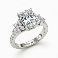 White Gold Radiant Cut Engagement Ring With Floral Diamond Cluster Sides And Pavé Band