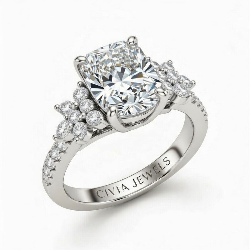 Silver Radiant Cut Engagement Ring With Floral Diamond Cluster Sides And Pavé Band