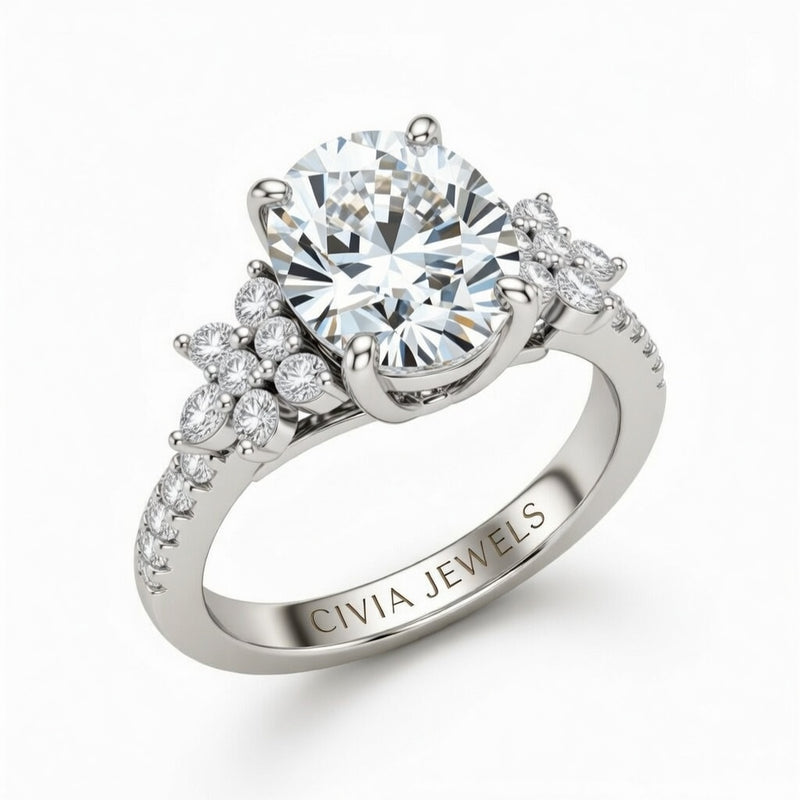 White Gold Round Cut Engagement Ring With Floral Diamond Cluster Sides And Pavé Band