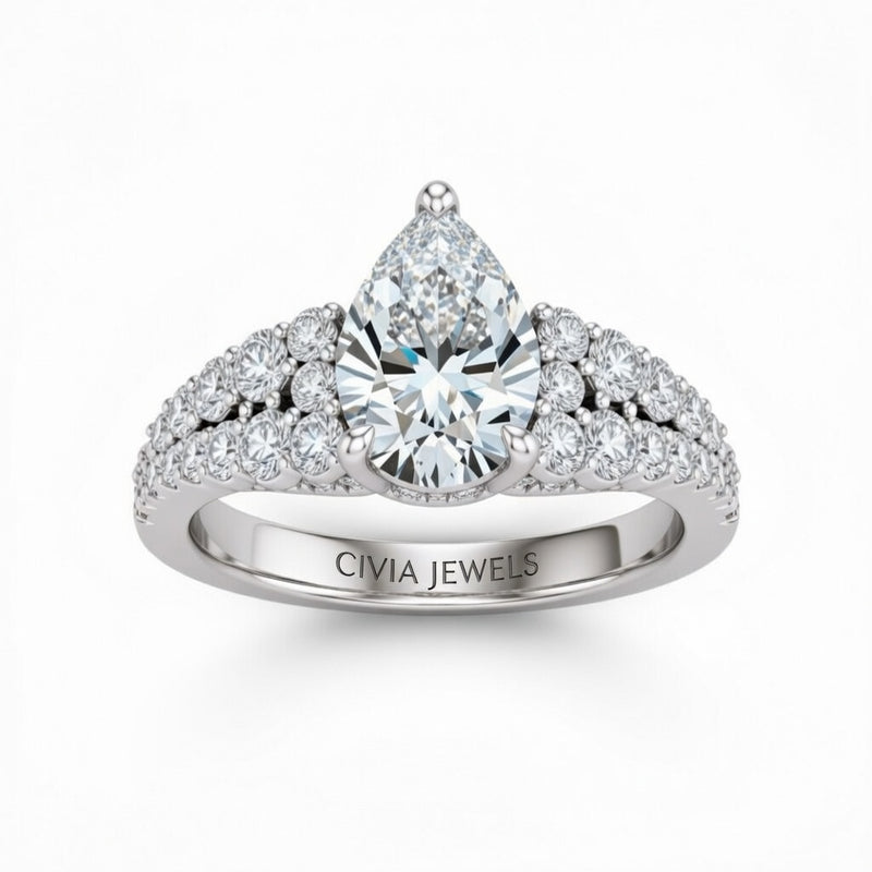 Silver Pear Cut Solitaire Engagement Ring With Pavé Diamond Band And Classic Four-Prong Setting