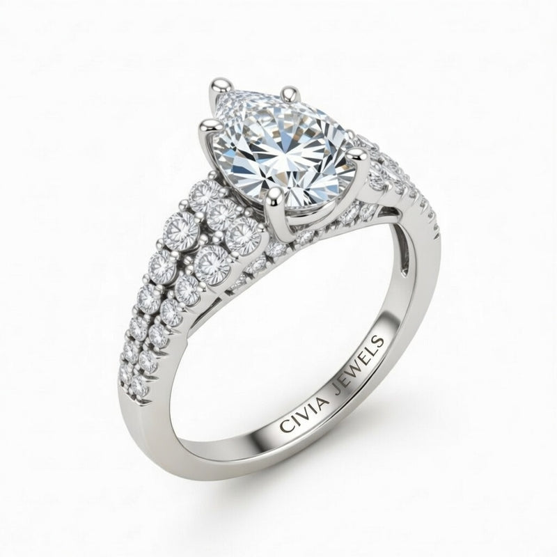 Silver Pear Cut Solitaire Engagement Ring With Pavé Diamond Band And Classic Four-Prong Setting