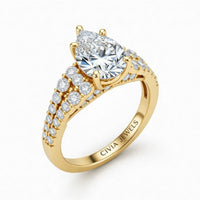 Yellow Gold Pear Cut Solitaire Engagement Ring With Pavé Diamond Band And Classic Four-Prong Setting