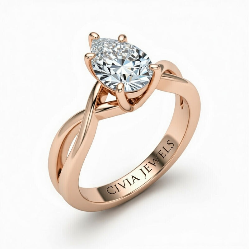 Rose Gold Pear Diamond Solitaire Engagement Ring With Interwoven Twist Shank
