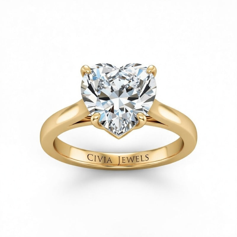 Yellow Gold Heart Cut Solitaire Engagement Ring with Sleek Tapered Shank