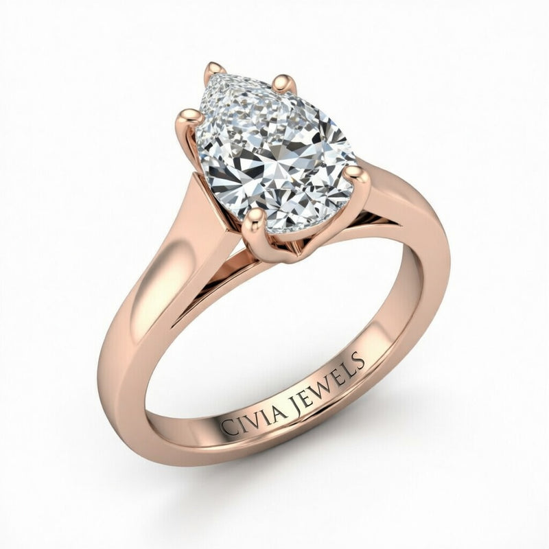 Rose Gold Pear Cut Solitaire Engagement Ring with Sleek Tapered Shank