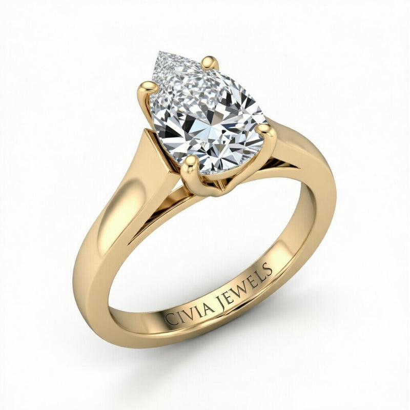 Yellow Gold Pear Cut Solitaire Engagement Ring with Sleek Tapered Shank
