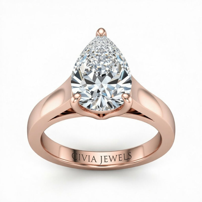 Rose Gold Pear Cut Solitaire Engagement Ring with Sleek Tapered Shank