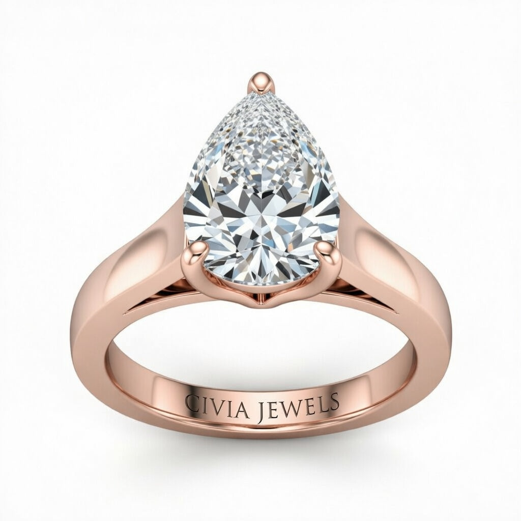 Rose Gold Pear Cut Solitaire Engagement Ring with Sleek Tapered Shank