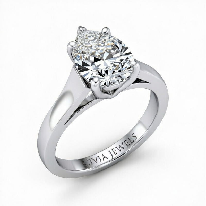Silver Pear Cut Solitaire Engagement Ring with Sleek Tapered Shank
