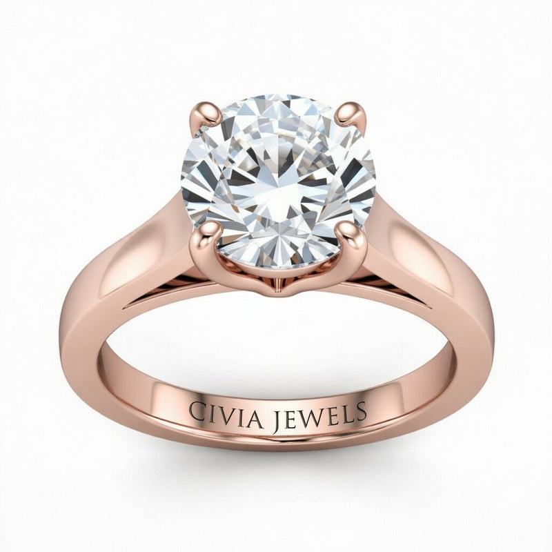 Rose Gold Round Cut Solitaire Engagement Ring with Sleek Tapered Shank