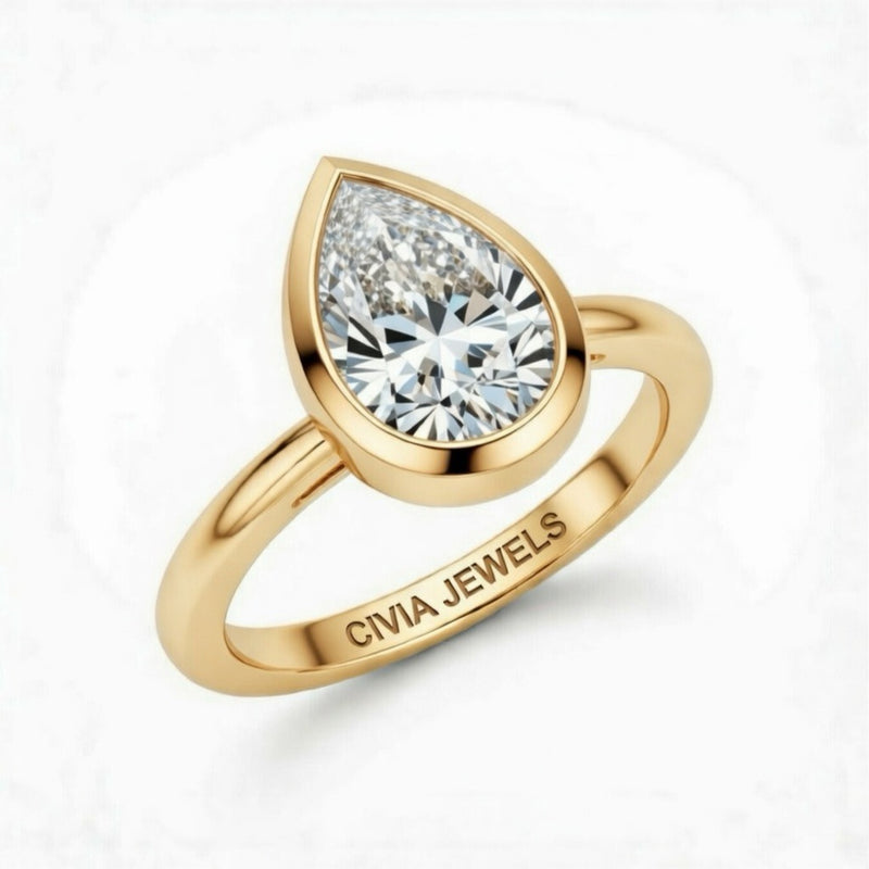 Yellow Gold Pear Cut Bezel Set Solitaire Engagement Ring with Polished Comfort Fit Band
