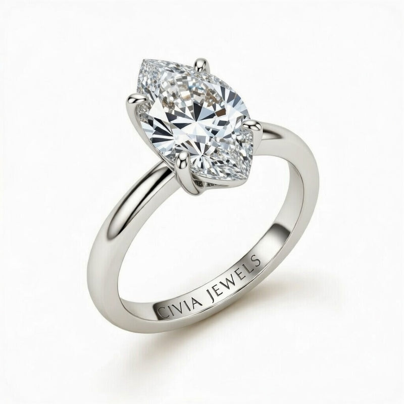 White Gold Marquise Cut Solitaire Engagement Ring with Sculpted Tapered Shank