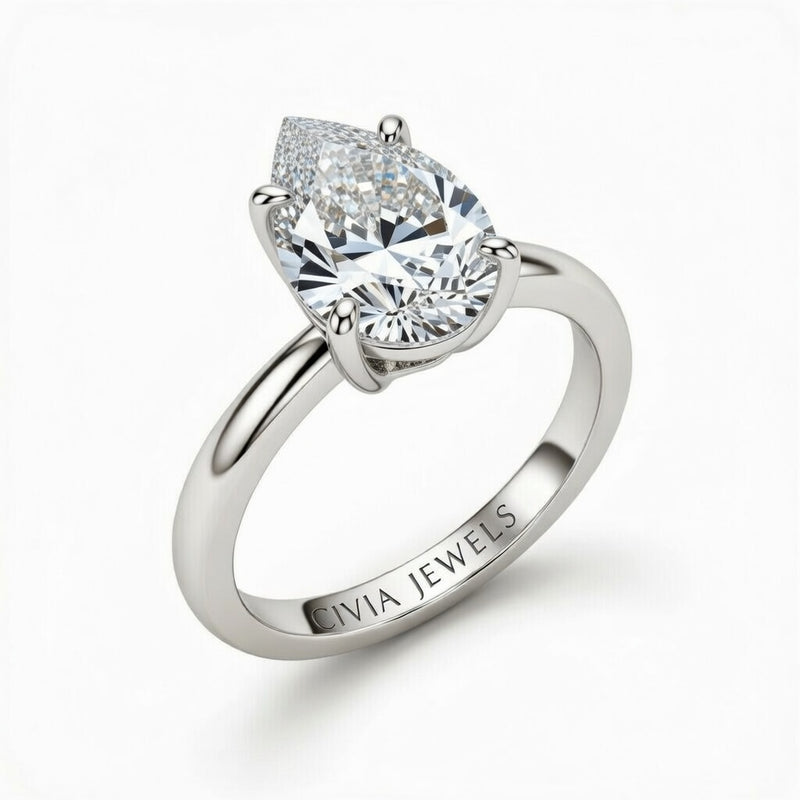 White Gold Pear Cut Solitaire Engagement Ring with Sculpted Tapered Shank