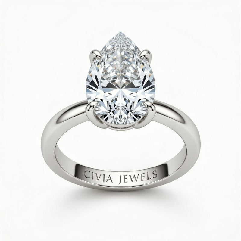 White Gold Pear Cut Solitaire Engagement Ring with Sculpted Tapered Shank