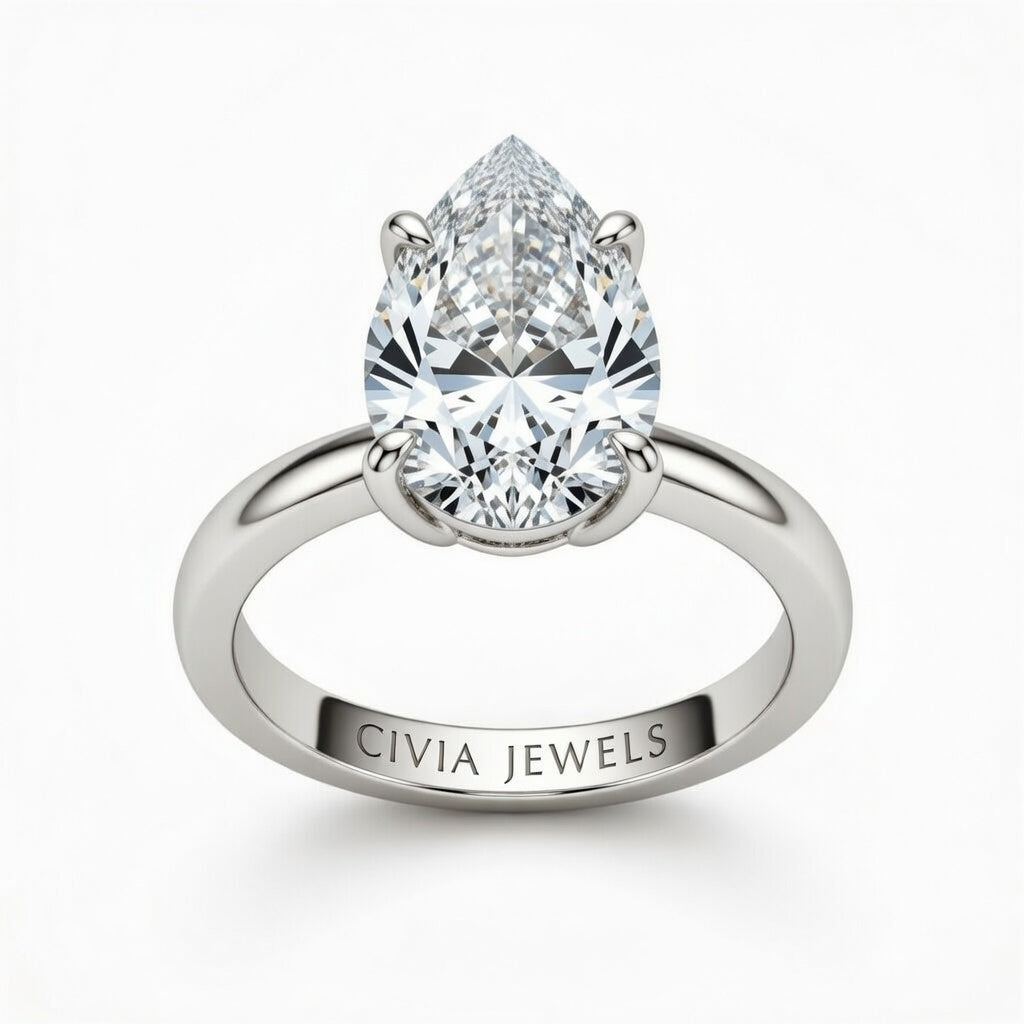 White Gold Pear Cut Solitaire Engagement Ring with Sculpted Tapered Shank