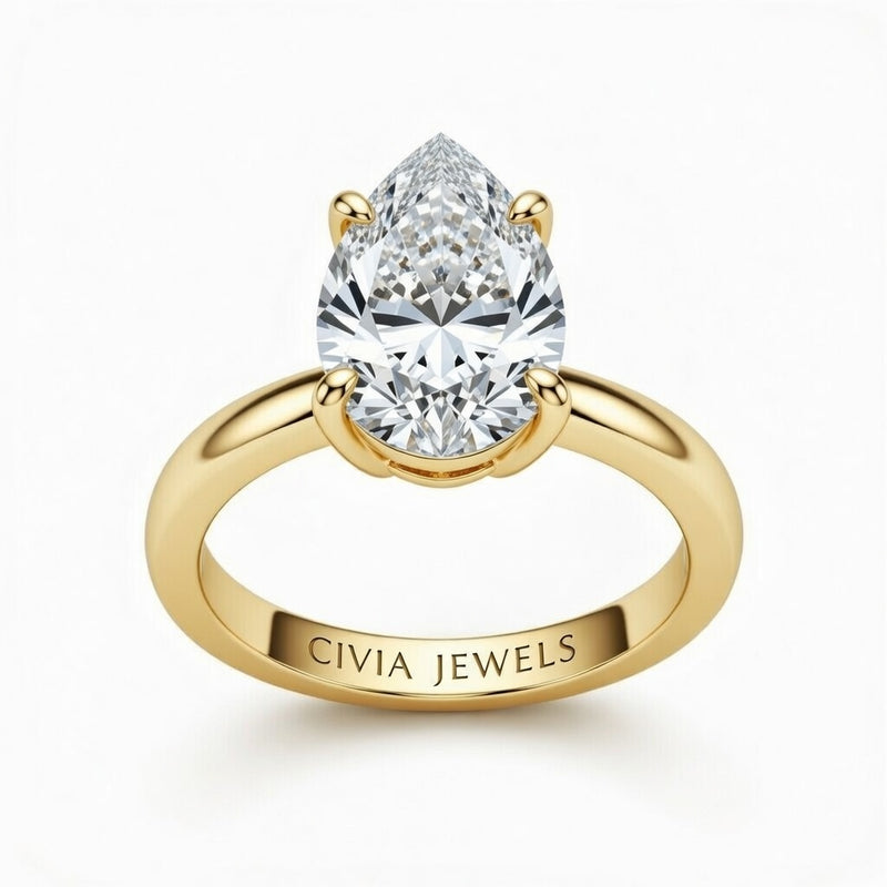Yellow Gold Pear Cut Solitaire Engagement Ring with Sculpted Tapered Shank
