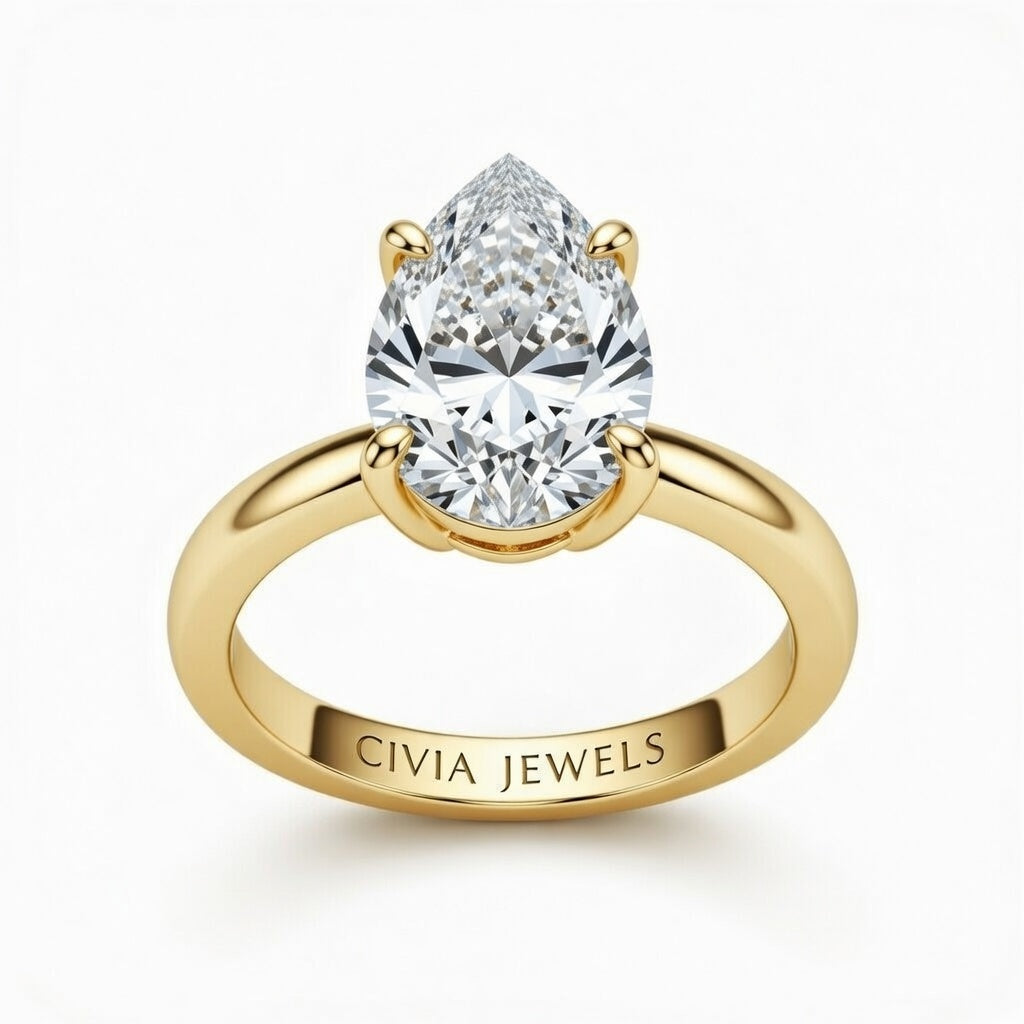 Yellow Gold Pear Cut Solitaire Engagement Ring with Sculpted Tapered Shank