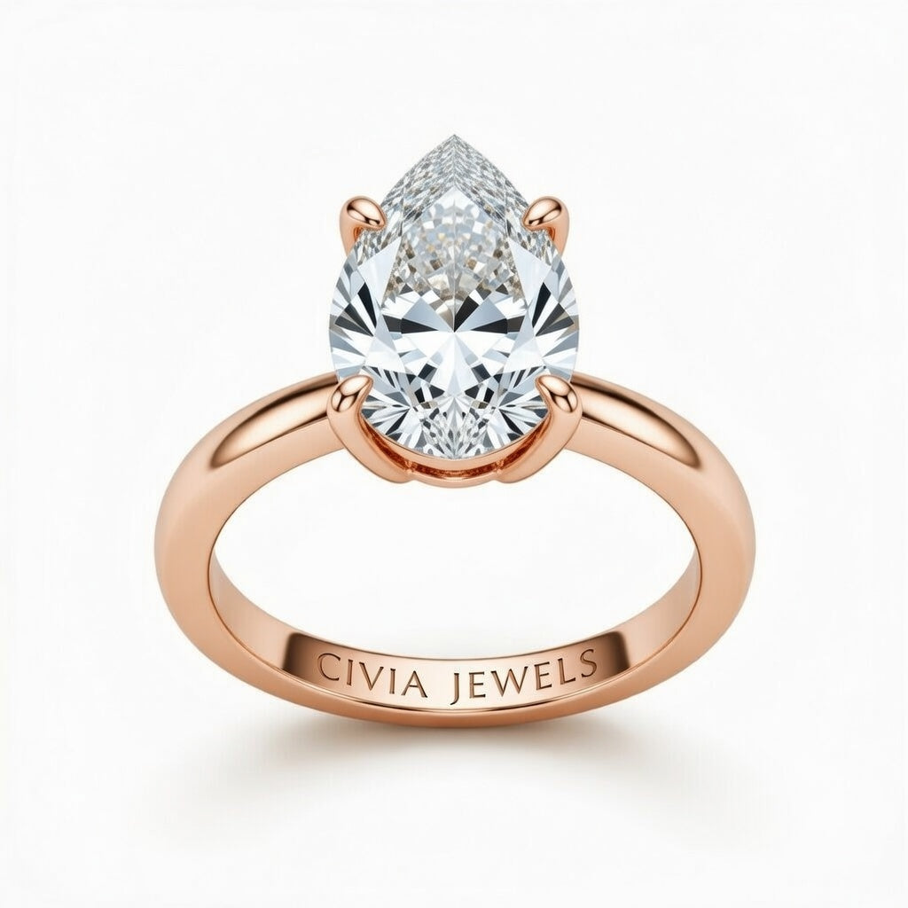 Rose Gold Pear Cut Solitaire Engagement Ring with Sculpted Tapered Shank