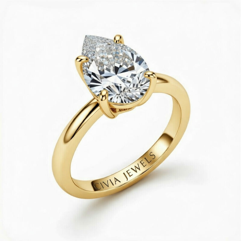 Yellow Gold Pear Cut Solitaire Engagement Ring with Sculpted Tapered Shank