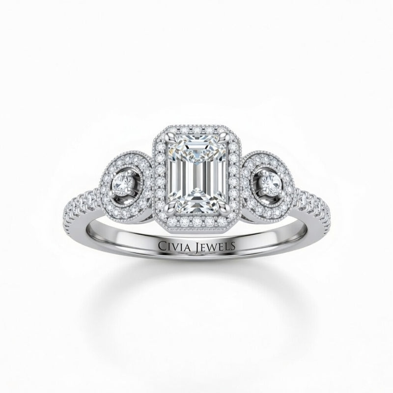 White Gold Emerald Brilliant Three Stone Halo Engagement Ring With Vintage Milgrain Detail