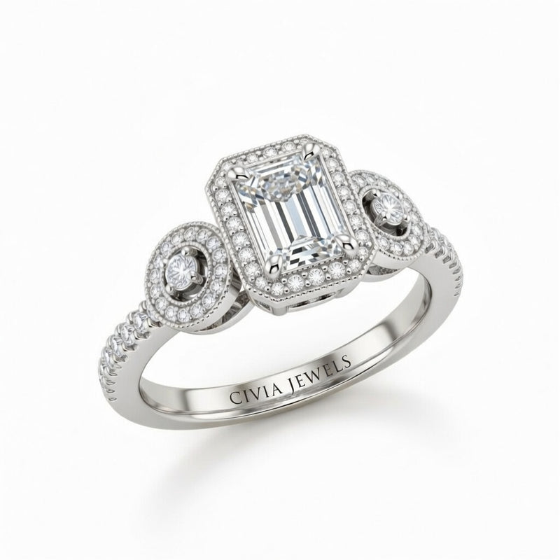 White Gold Emerald Brilliant Three Stone Halo Engagement Ring With Vintage Milgrain Detail