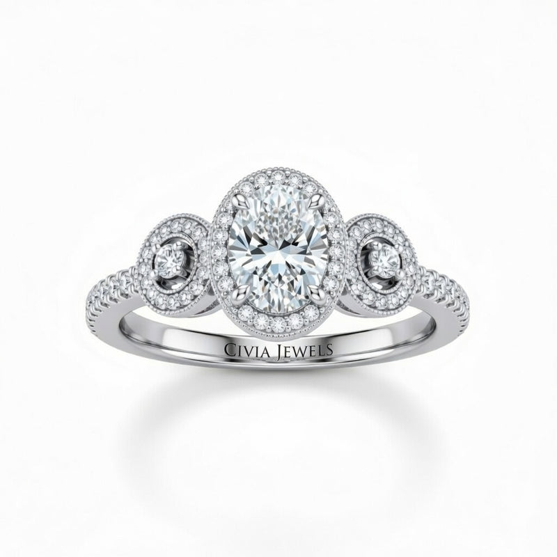 White Gold Oval Brilliant Three Stone Halo Engagement Ring With Vintage Milgrain Detail