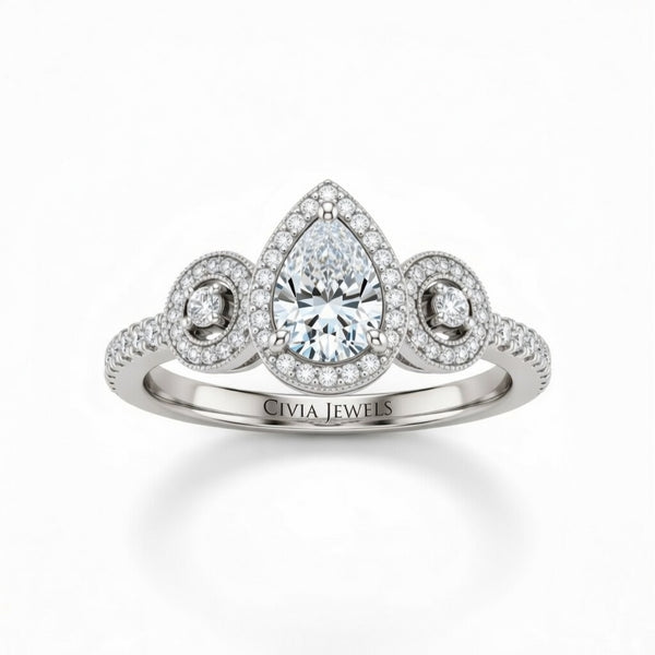White Gold Pear Brilliant Three Stone Halo Engagement Ring With Vintage Milgrain Detail