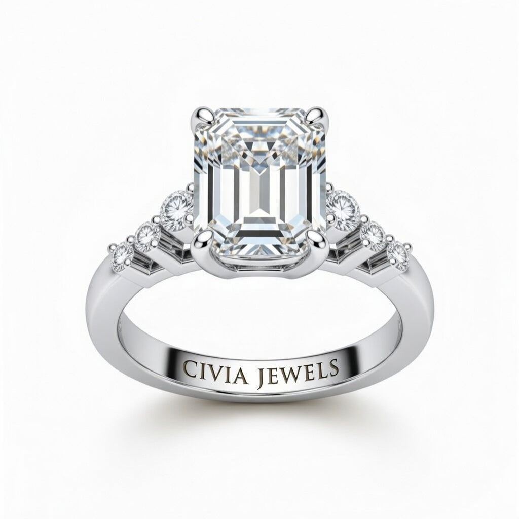 Silver Emerald Cut Engagement Ring With Diamond Scatter Accent Shoulders And Classic Four-Prong Setting