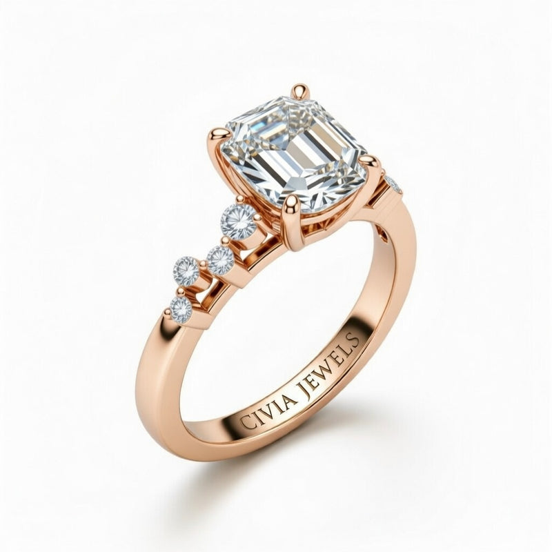 Rose Gold Emerald Cut Engagement Ring With Diamond Scatter Accent Shoulders And Classic Four-Prong Setting