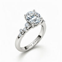 Silver Oval Cut Engagement Ring With Diamond Scatter Accent Shoulders And Classic Four-Prong Setting
