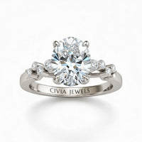 Silver Oval Cut Engagement Ring With Diamond Scatter Accent Shoulders And Classic Four-Prong Setting