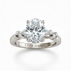 Silver Oval Cut Engagement Ring With Diamond Scatter Accent Shoulders And Classic Four-Prong Setting