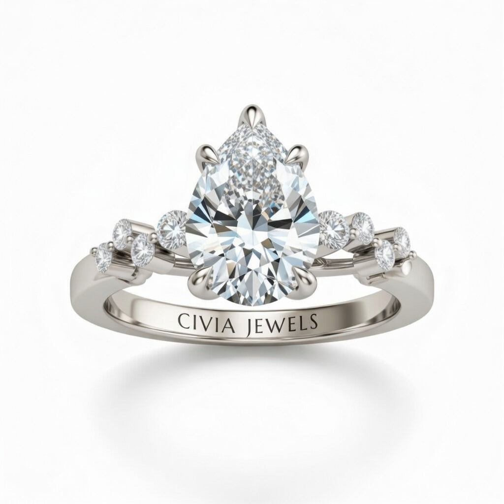 Silver Pear Cut Engagement Ring With Diamond Scatter Accent Shoulders And Classic Four-Prong Setting