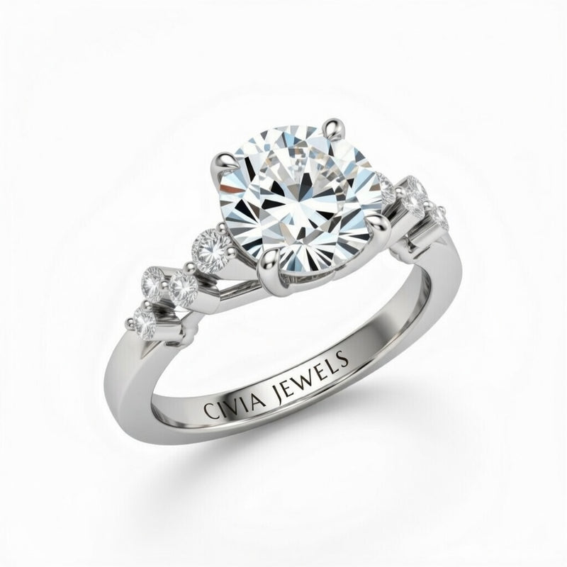 White Gold Round Cut Engagement Ring With Diamond Scatter Accent Shoulders And Classic Four-Prong Setting