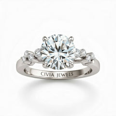 Silver Round Cut Engagement Ring With Diamond Scatter Accent Shoulders And Classic Four-Prong Setting