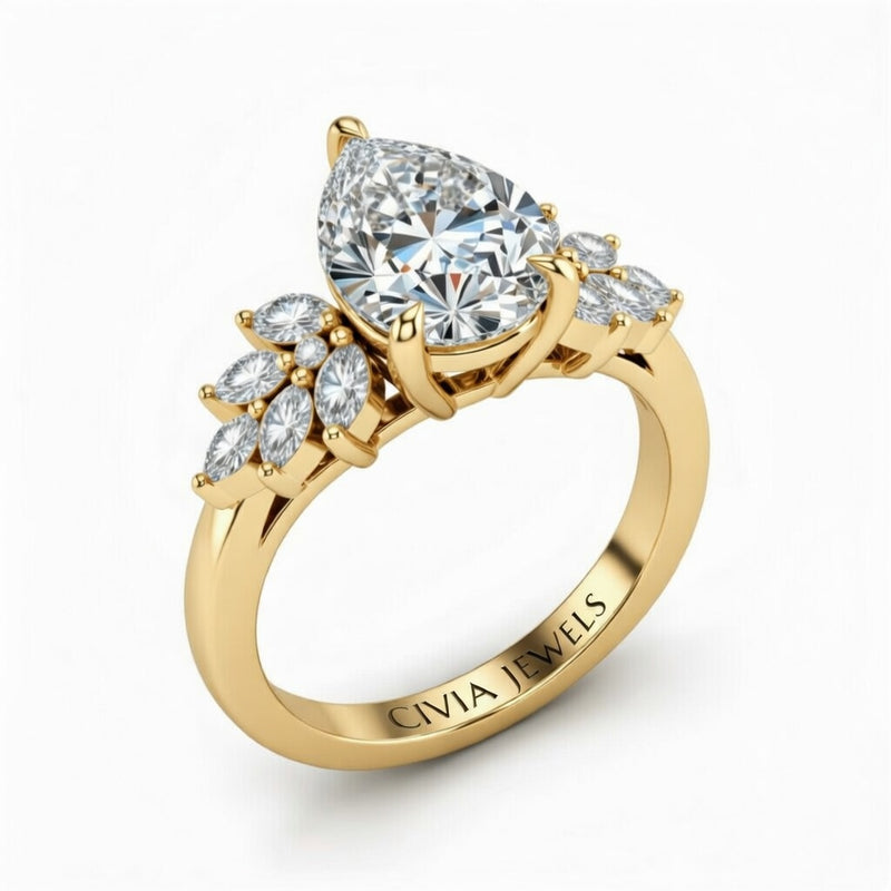 Yellow Gold Pear Cut Engagement Ring With Marquise Diamond Cluster Side Accents