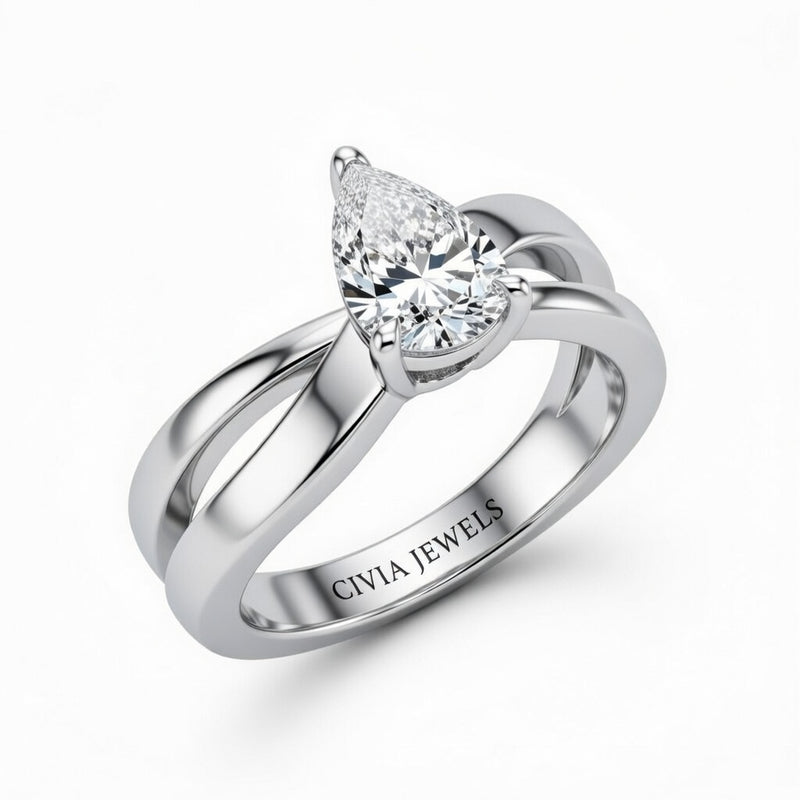 White Gold Pear Cut Solitaire Engagement Ring With Sculpted Multirow Twist Shank
