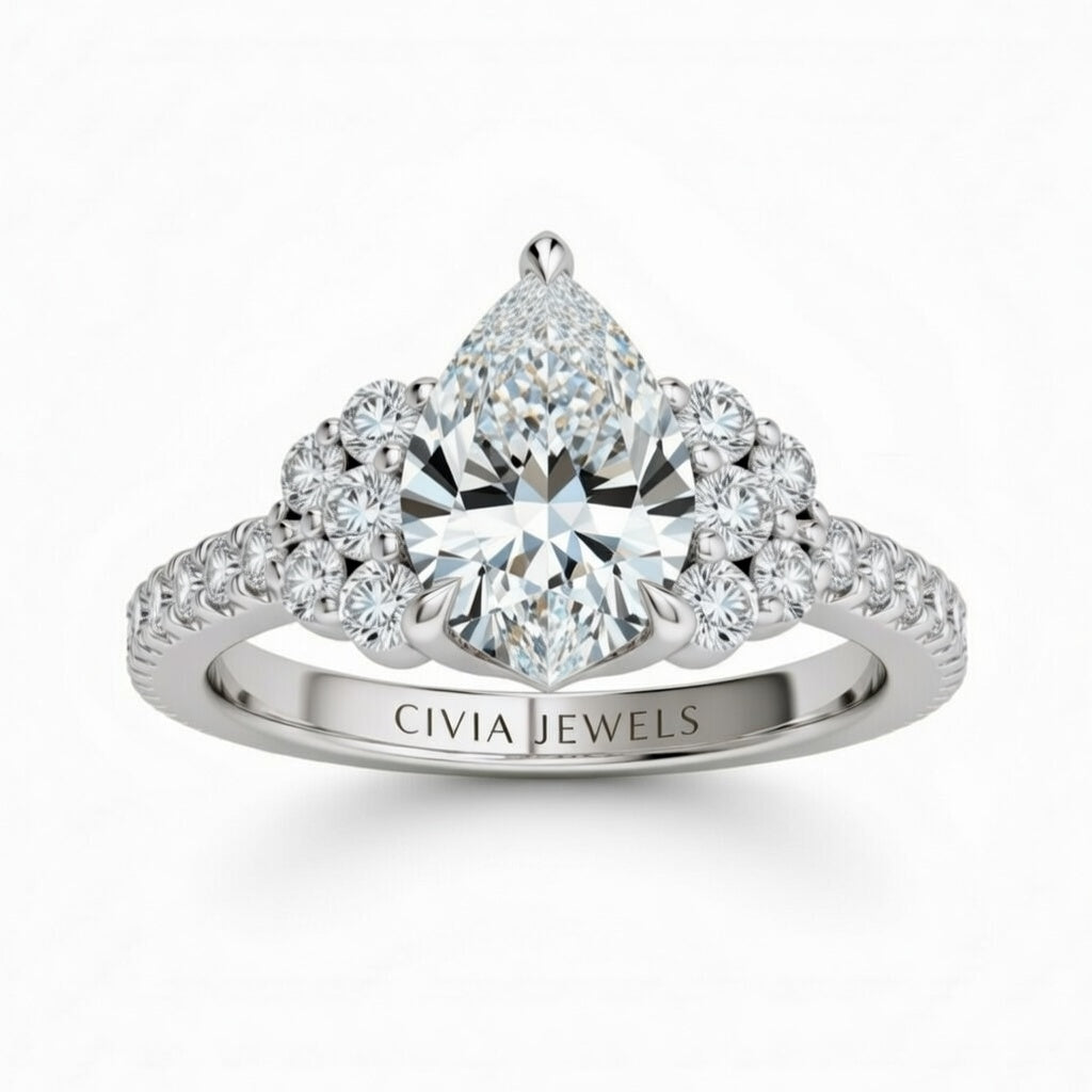 Silver Pear Cut Engagement Ring With Diamond Cluster Side Accents And Pavé Band