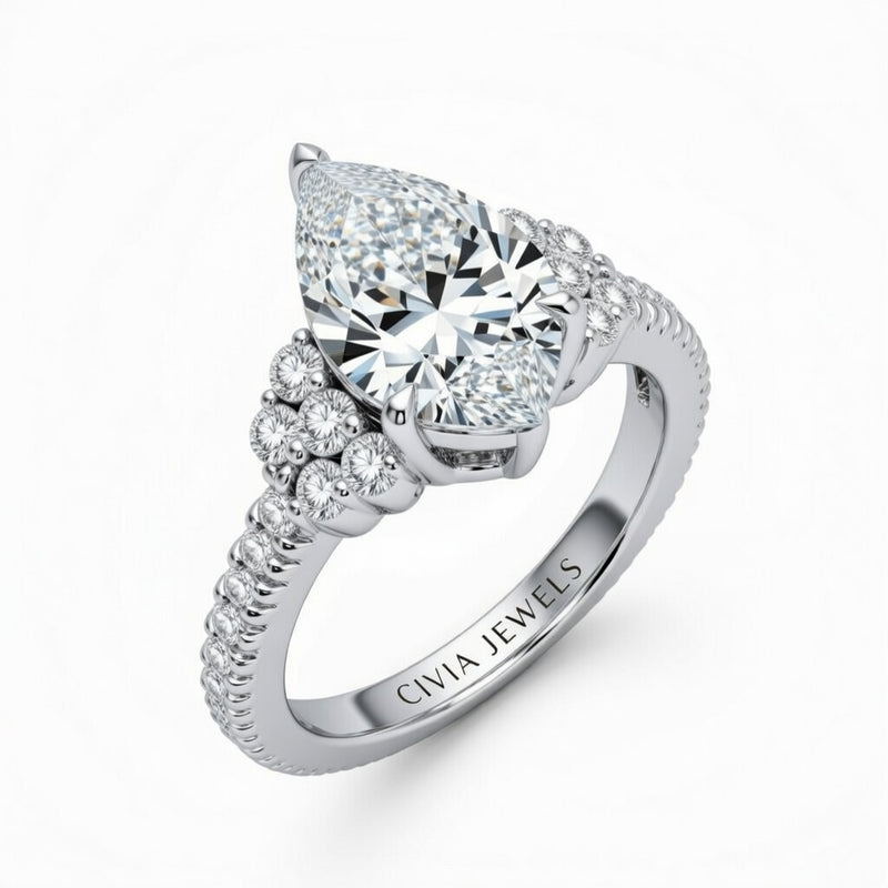 Silver Pear Cut Engagement Ring With Diamond Cluster Side Accents And Pavé Band