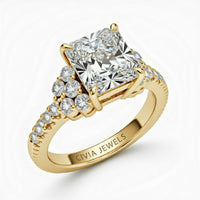 Yellow Gold Radiant Cut Engagement Ring With Diamond Cluster Side Accents And Pavé Band