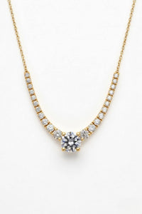 Yellow Gold Round Brilliant Signature Graduated Diamond Necklace With Solitaire Center And Four-Prong Setting