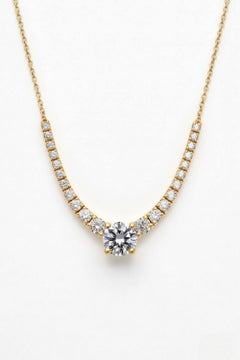 Yellow Gold Round Brilliant Signature Graduated Diamond Necklace With Solitaire Center And Four-Prong Setting