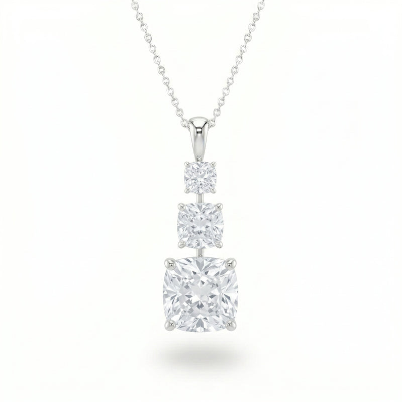 Silver Cushion Brilliant Trivessa Diamond Graduated Drop Pendant Necklace With Triple Stone Prong Setting