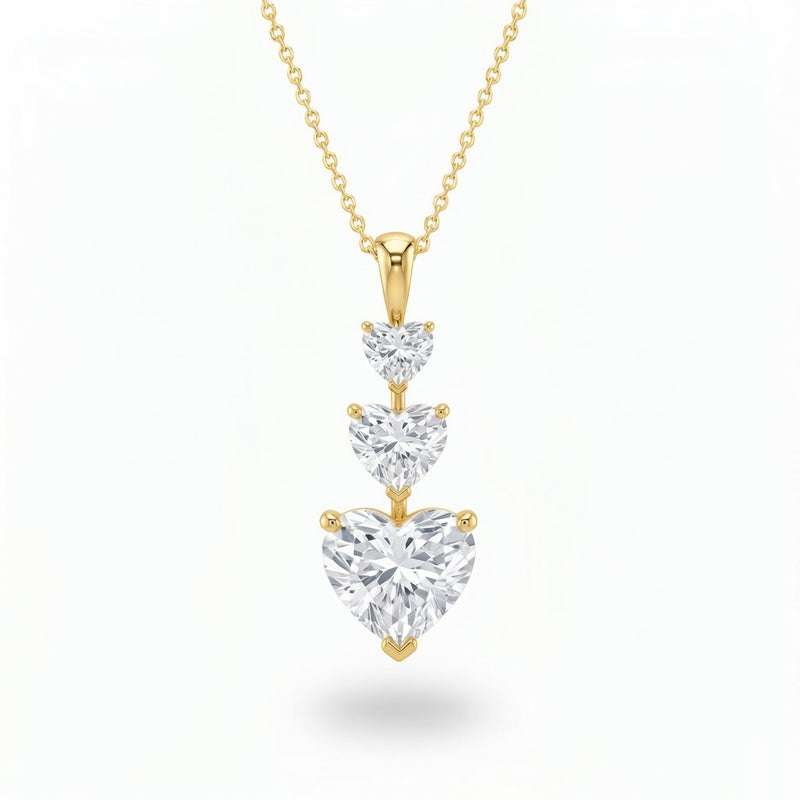Yellow Gold Heart Brilliant Trivessa Diamond Graduated Drop Pendant Necklace With Triple Stone Prong Setting