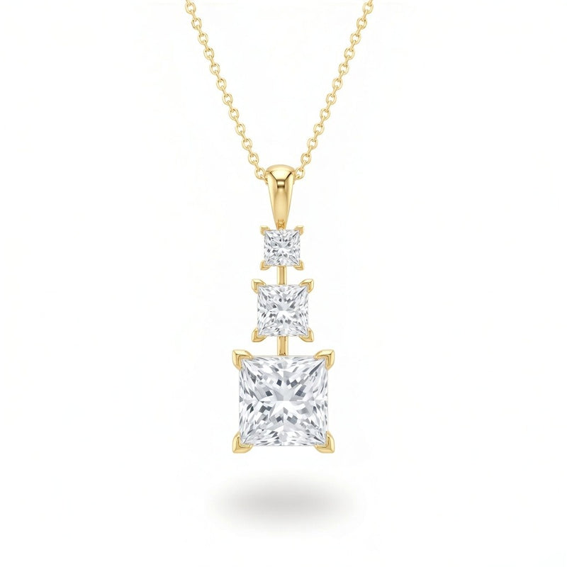 Yellow Gold Princess Brilliant Trivessa Diamond Graduated Drop Pendant Necklace With Triple Stone Prong Setting
