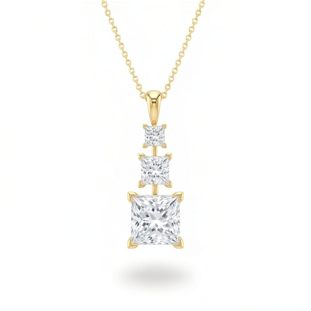Yellow Gold Princess Brilliant Trivessa Diamond Graduated Drop Pendant Necklace With Triple Stone Prong Setting
