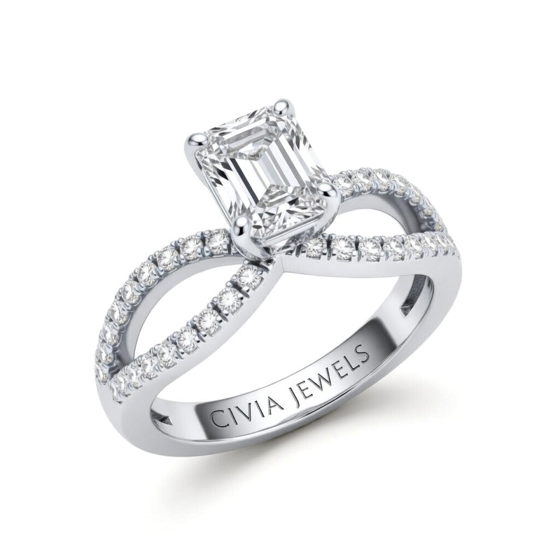 White Gold Emerald Diamond Twisted Shank Engagement Ring With Four Prong Setting And Pavé Band