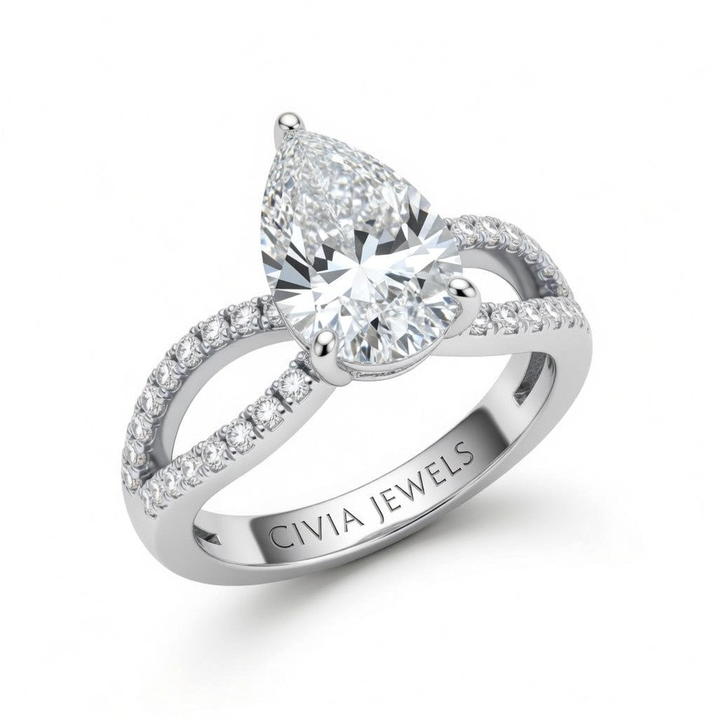 White Gold Pear Diamond Twisted Shank Engagement Ring With Four Prong Setting And Pavé Band