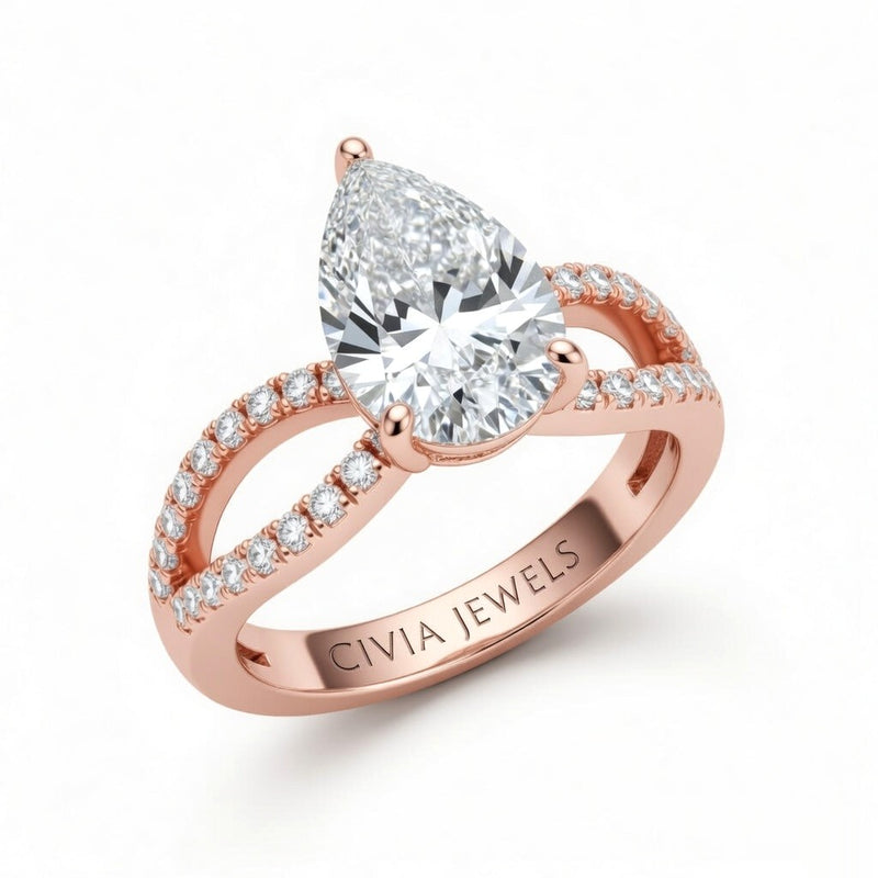 Rose Gold Pear Diamond Twisted Shank Engagement Ring With Four Prong Setting And Pavé Band