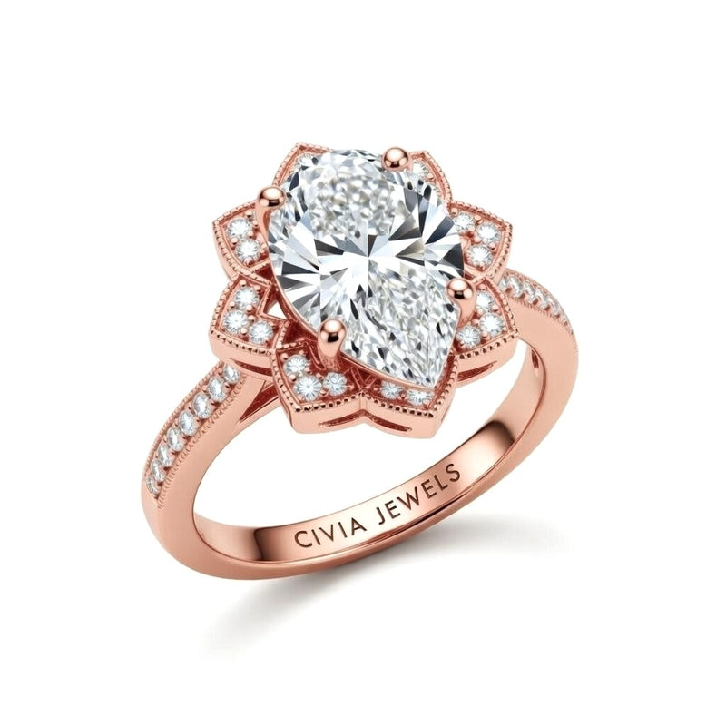 Rose Gold Pear Diamond Vintage Halo Engagement Ring With Four Prong Setting And Pavé Band